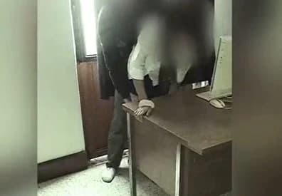 The camera writes off teachers and student in the school office