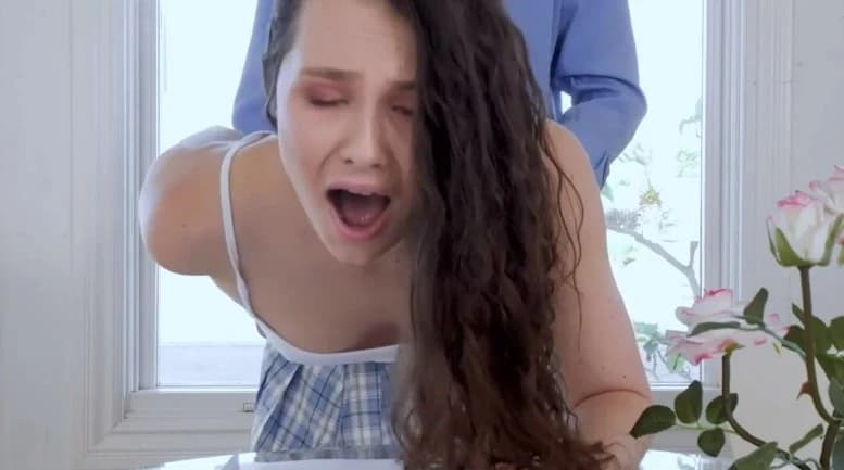 Dad helps his daughter with her homework
